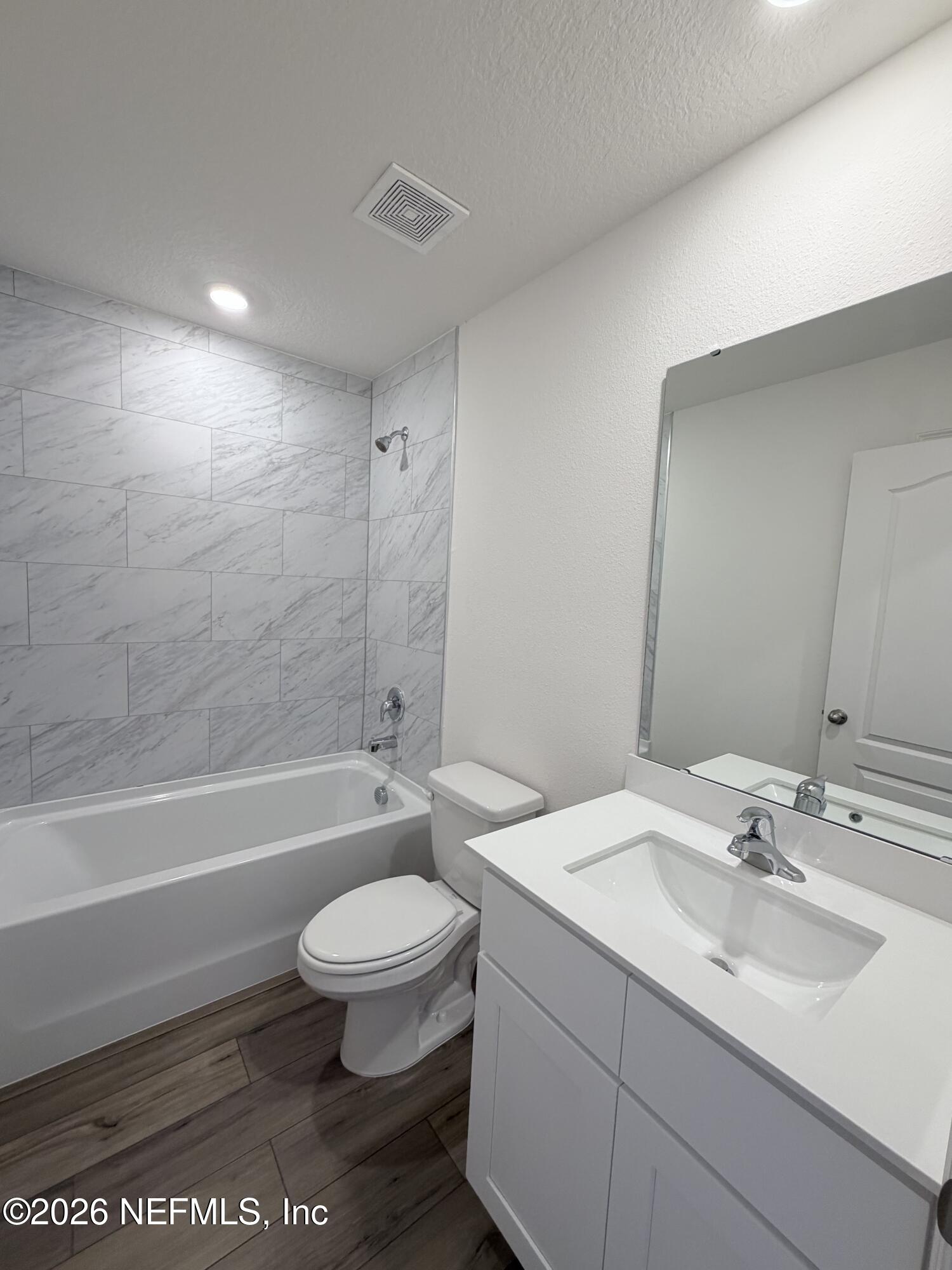 37397 Whisper Way Hilliard, FL 32046 - Photo 9 of 9 a bathroom with a sink a toilet and a bathtub