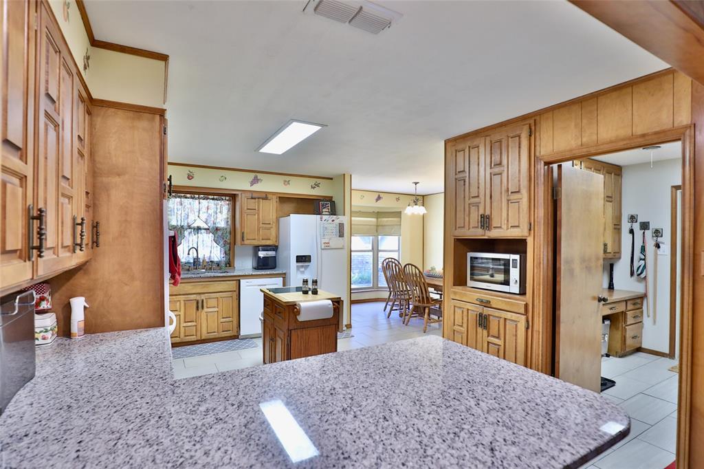 448 Elmdale Road South Abilene, TX 79602 - Photo 9 of 39 a living room with stainless steel appliances granite countertop furniture and a kitchen view