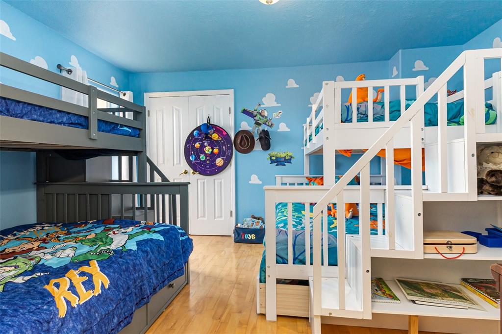 302 Vista Loop Davenport, FL 33897 - Photo 14 of 22 a living room filled with furniture and a baby crib