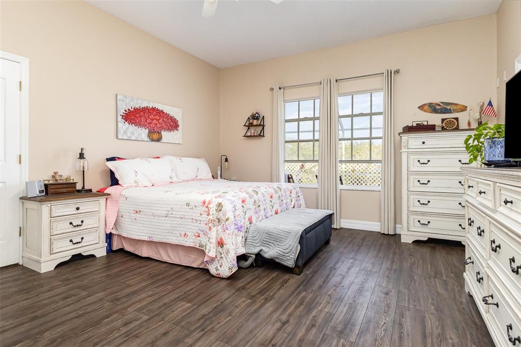 302 Vista Loop Davenport, FL 33897 - Photo 8 of 22 a bedroom with a bed and a dresser