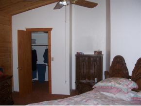 3229 Double A Ranch Road Ash Fork, AZ 86320 - Photo 5 of 12 a bedroom with a bed and a closet