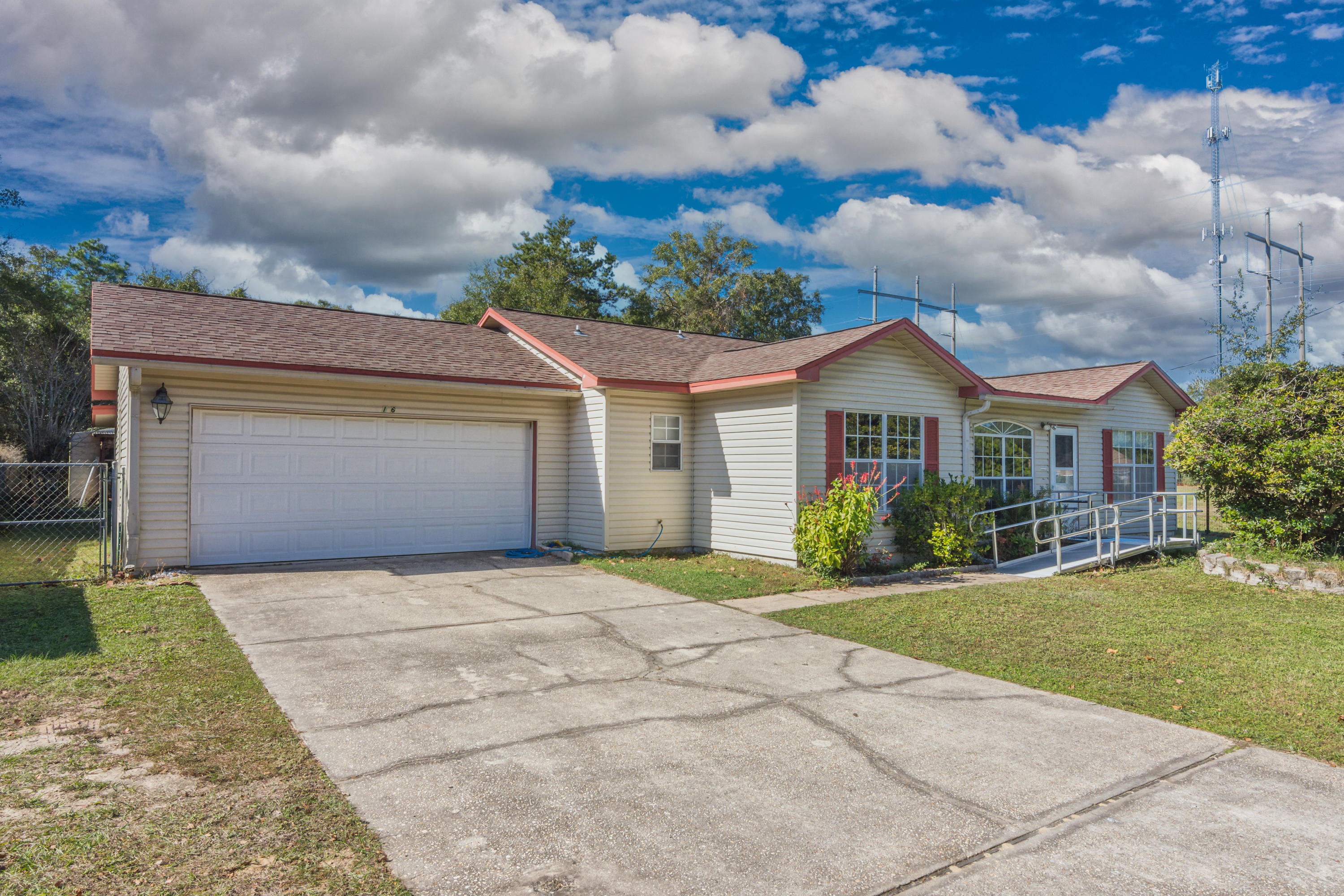 216 Brookmeade Drive Crestview, FL 32539 - Photo 1 of 29 a front view of a house with a yard and garage
