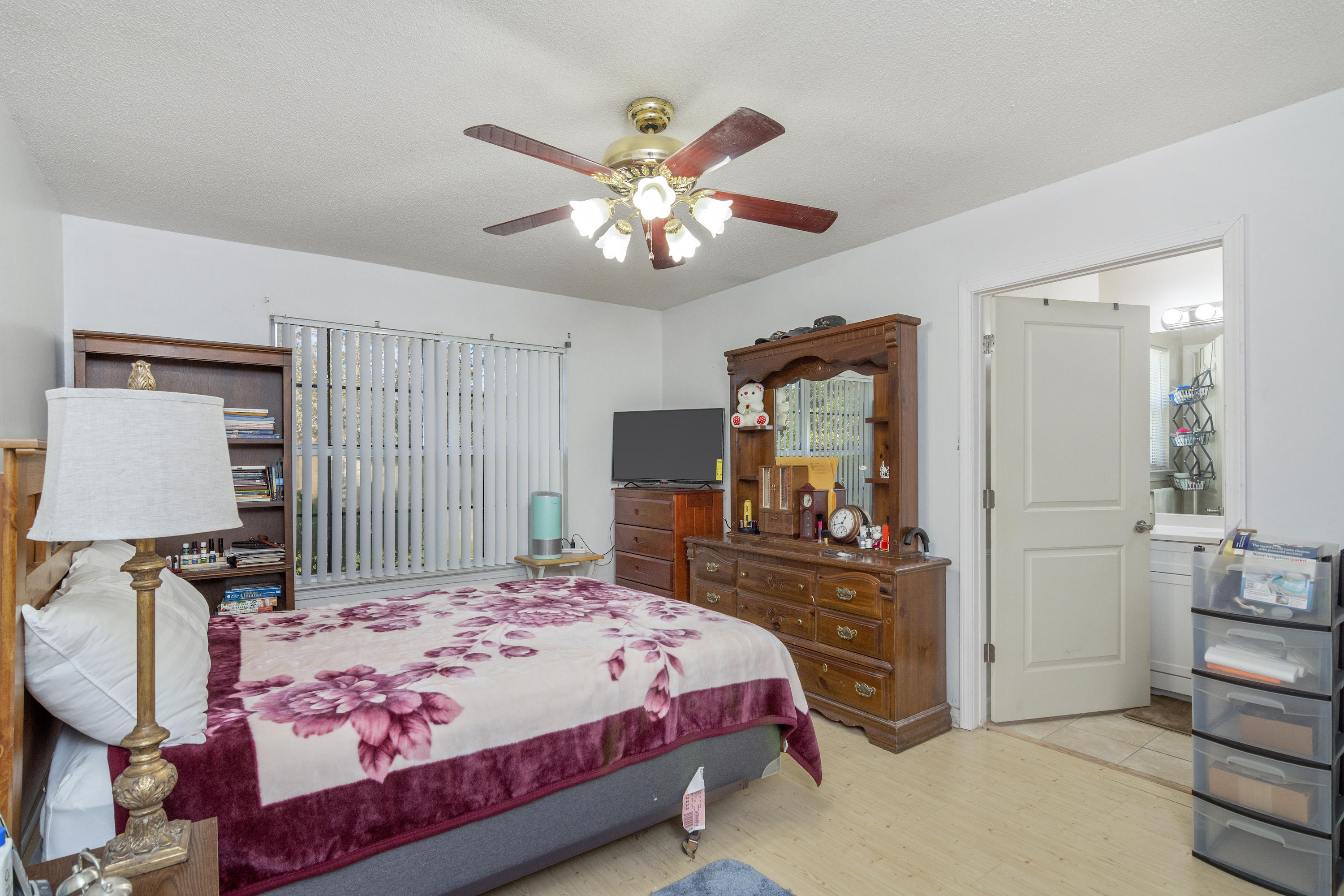 216 Brookmeade Drive Crestview, FL 32539 - Photo 12 of 29 a bedroom with a bed and a chandelier
