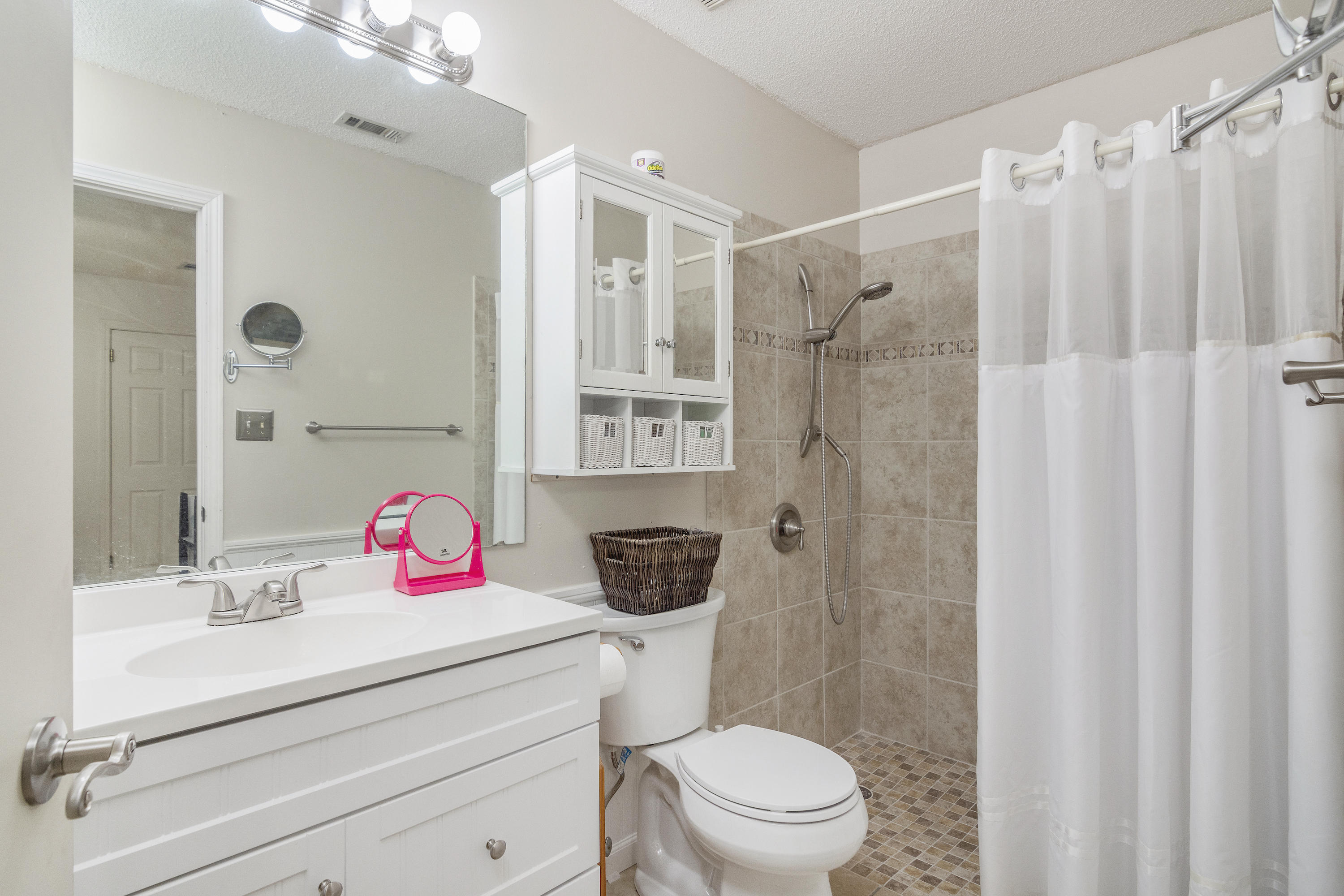 216 Brookmeade Drive Crestview, FL 32539 - Photo 13 of 29 a bathroom with a sink a toilet a shower and a mirror