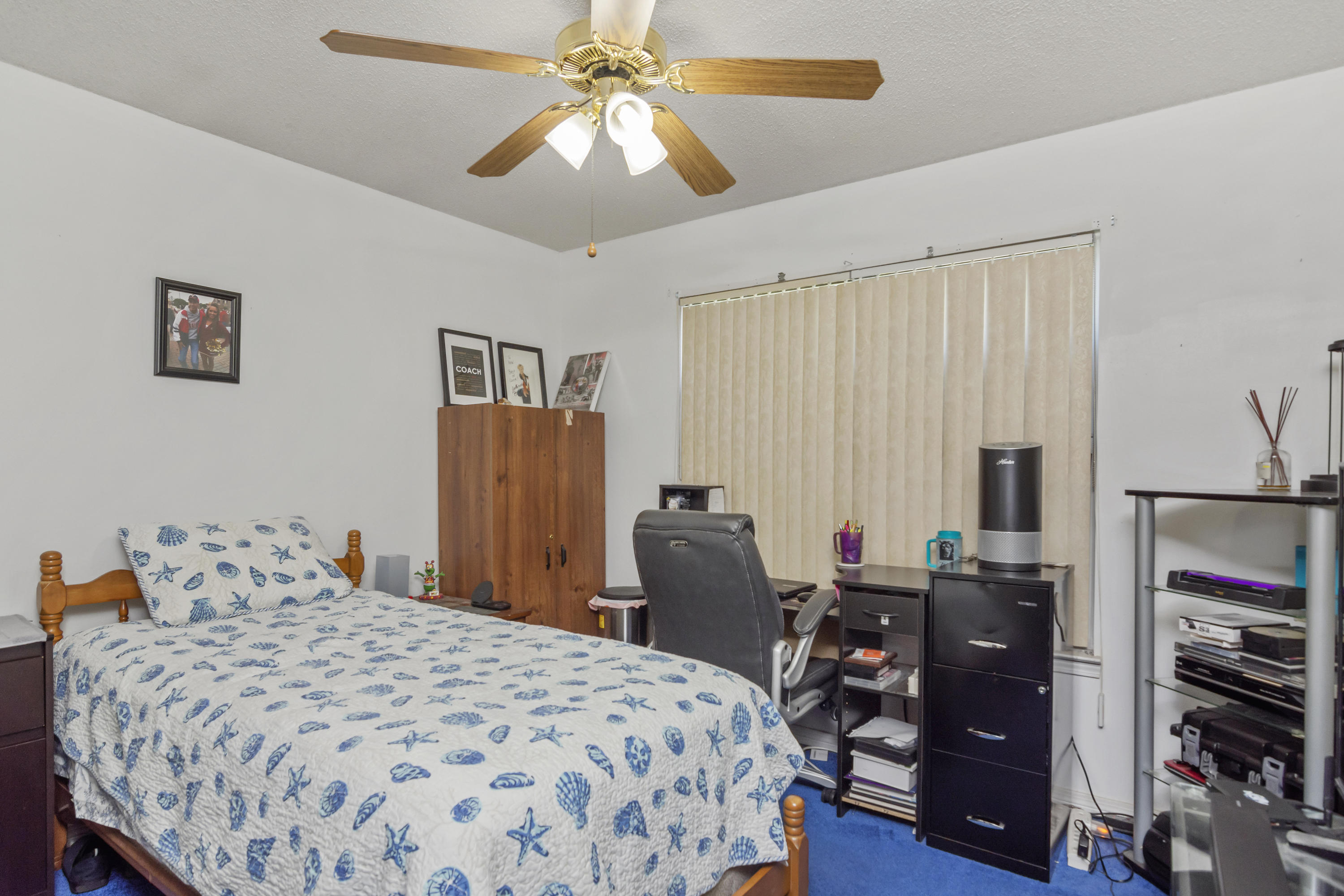 216 Brookmeade Drive Crestview, FL 32539 - Photo 16 of 29 a bedroom with a bed and wooden floor