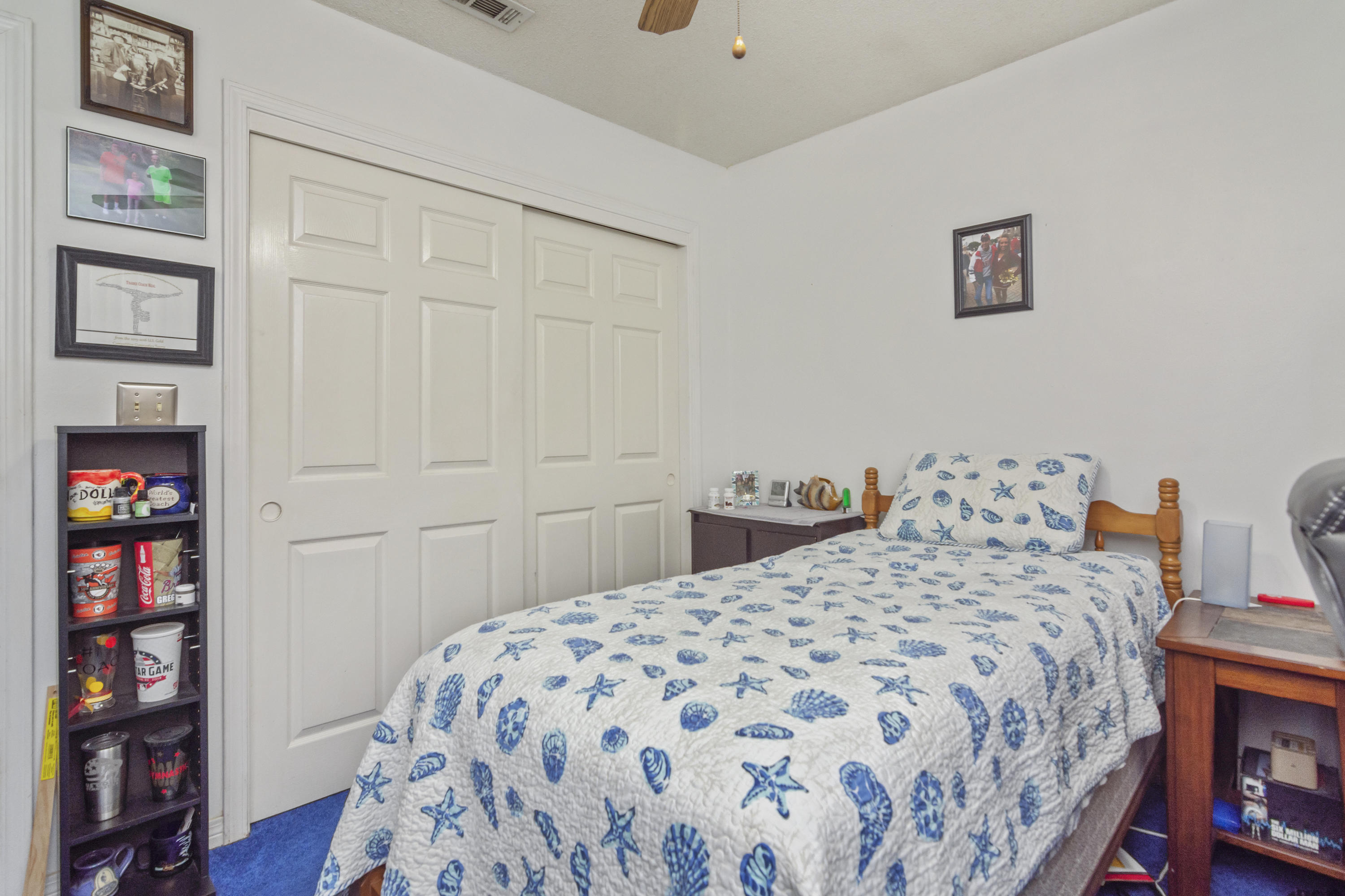 216 Brookmeade Drive Crestview, FL 32539 - Photo 17 of 29 a bedroom with a bed and a book shelf