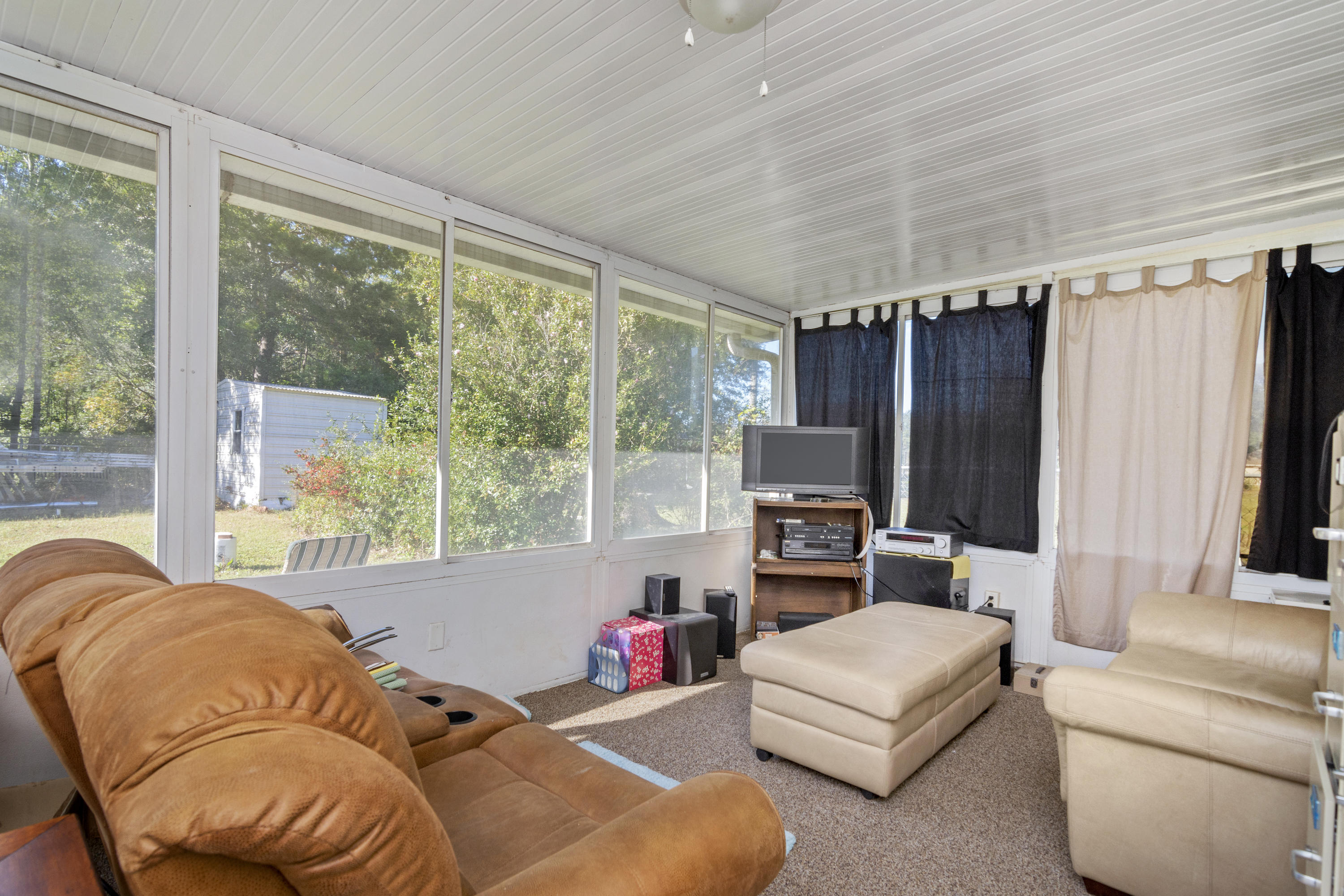 216 Brookmeade Drive Crestview, FL 32539 - Photo 21 of 29 a living room with furniture and a large window