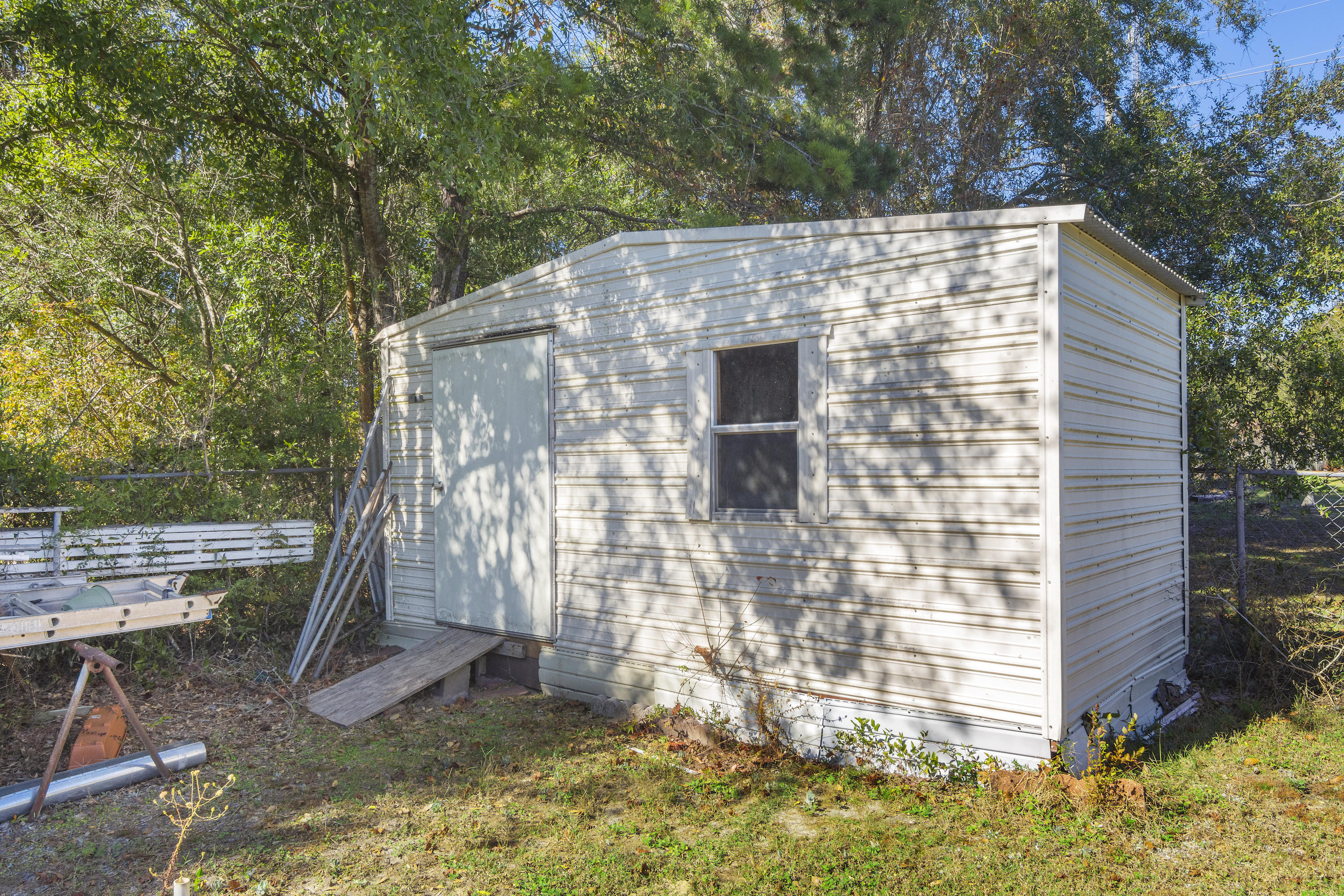 216 Brookmeade Drive Crestview, FL 32539 - Photo 27 of 29 a brick building with a yard