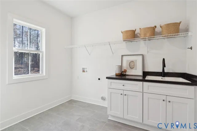 a spacious bedroom with a bed and wooden floor