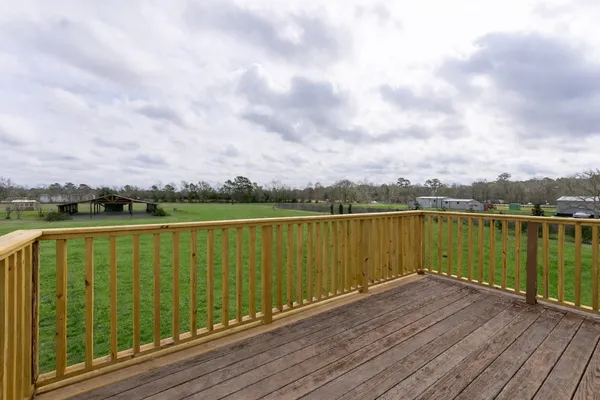 a view of a lake with wooden floor