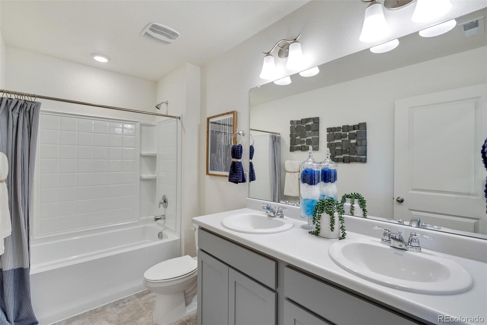 830 Elias Tarn Drive Severance, CO 80550 - Photo 26 of 30 a bathroom with a sink a toilet and shower