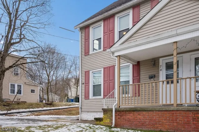 a front view of a house with a fence