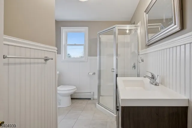 a view of hallway with wooden floor