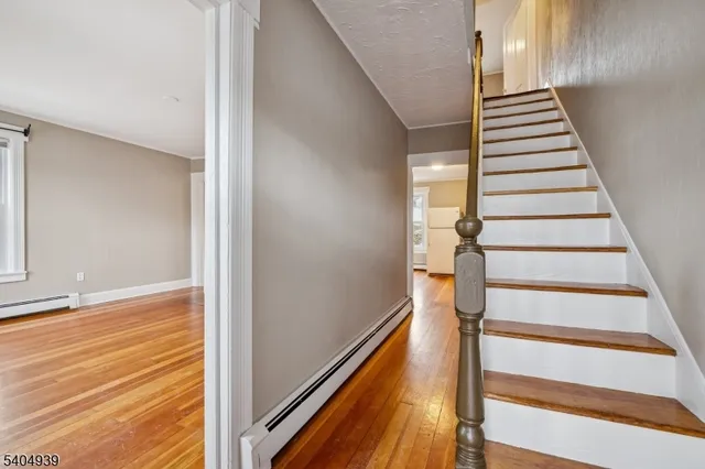 a view of entryway with wooden floor