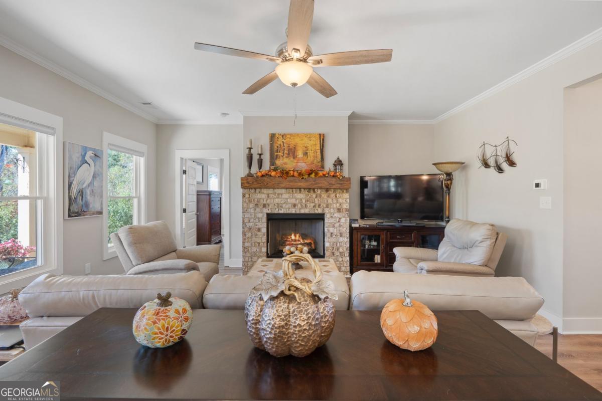 801 Holly Ridge Drive Gray, GA 31032 - Photo 11 of 51 a living room with furniture and a fireplace