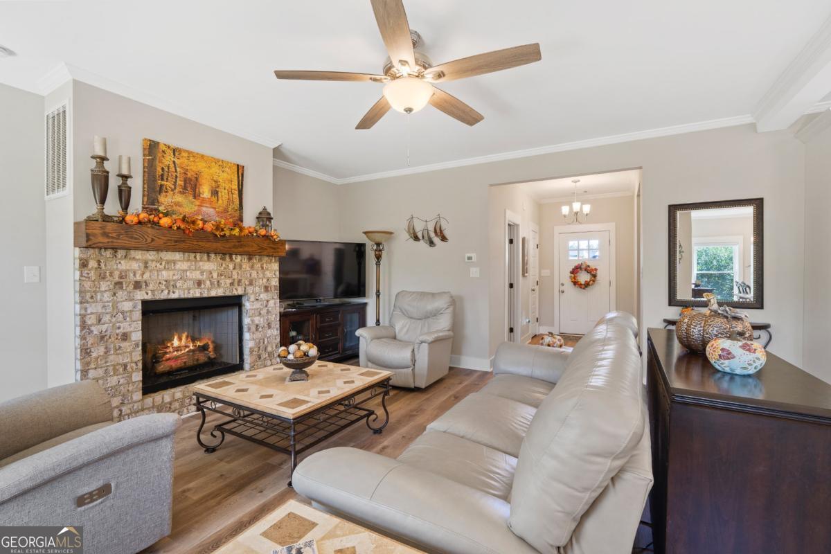 801 Holly Ridge Drive Gray, GA 31032 - Photo 12 of 51 a living room with furniture and a fireplace