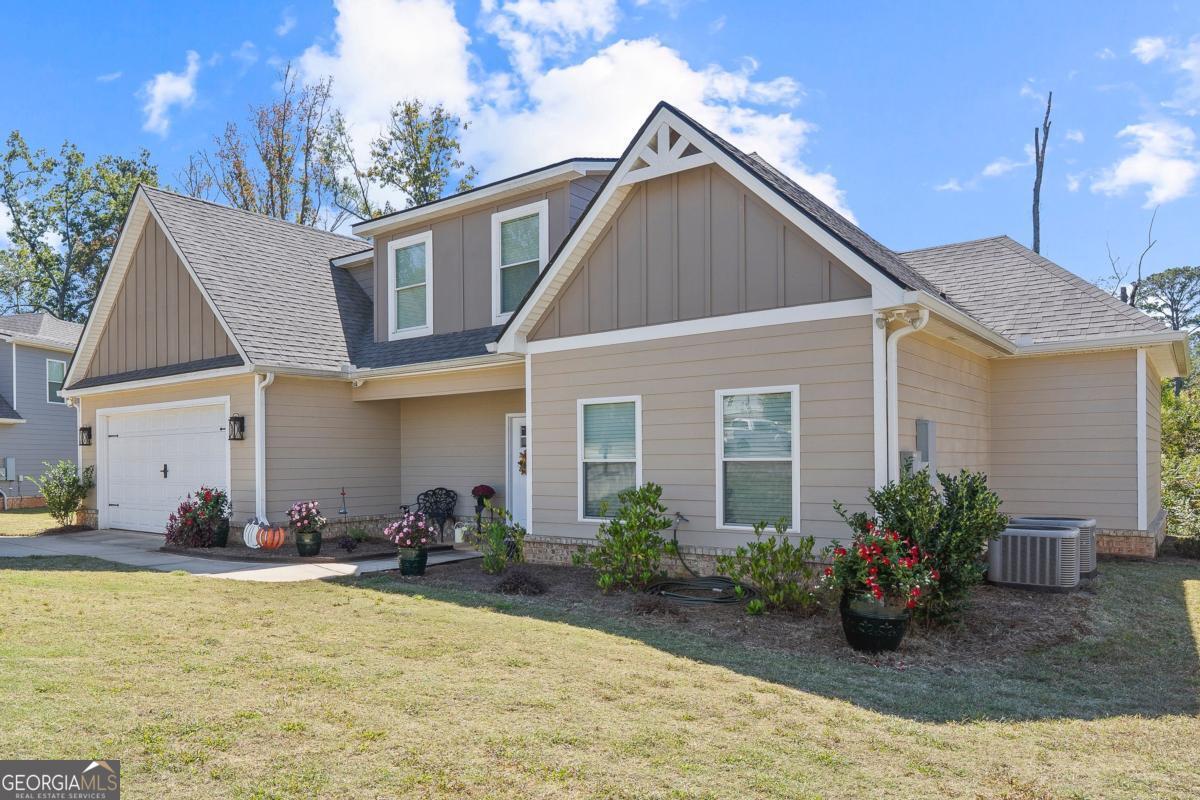 801 Holly Ridge Drive Gray, GA 31032 - Photo 2 of 51 a view of a house with backyard and plants