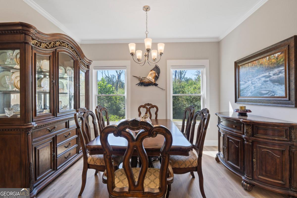 801 Holly Ridge Drive Gray, GA 31032 - Photo 22 of 51 a view of a dining room with furniture window and outside view