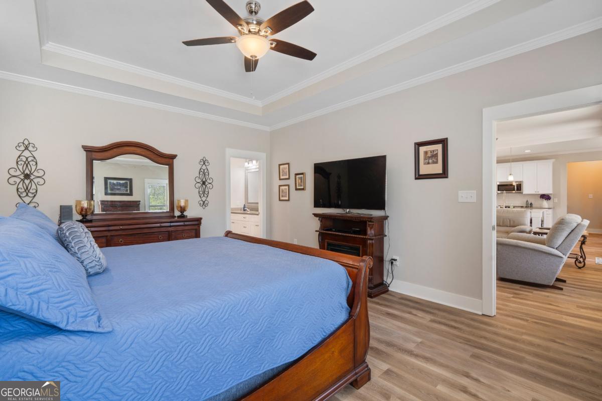 801 Holly Ridge Drive Gray, GA 31032 - Photo 27 of 51 a bedroom with a bed and a flat screen tv