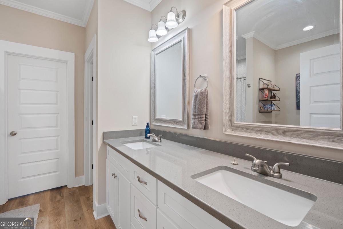 801 Holly Ridge Drive Gray, GA 31032 - Photo 28 of 51 a bathroom with a double vanity sink and a mirror