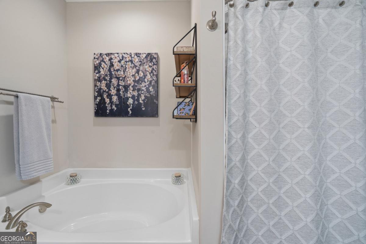 801 Holly Ridge Drive Gray, GA 31032 - Photo 29 of 51 a bathroom with a bathtub and shower
