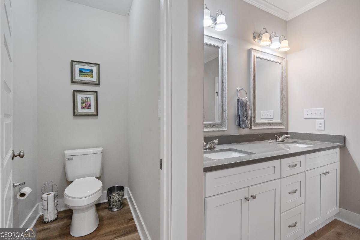801 Holly Ridge Drive Gray, GA 31032 - Photo 30 of 51 a bathroom with a granite countertop toilet sink and mirror