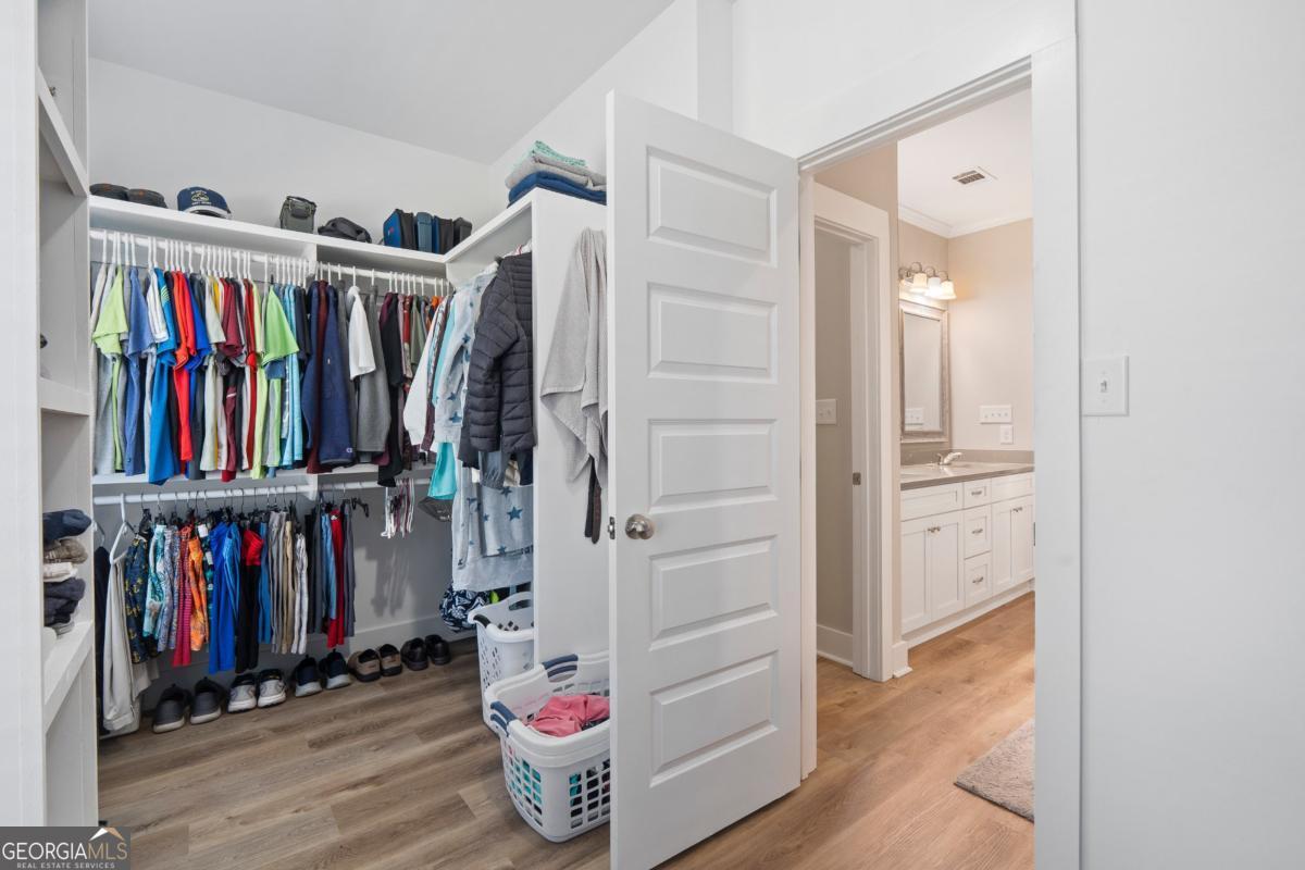 801 Holly Ridge Drive Gray, GA 31032 - Photo 31 of 51 a view of walk in closet with clothes and shoes