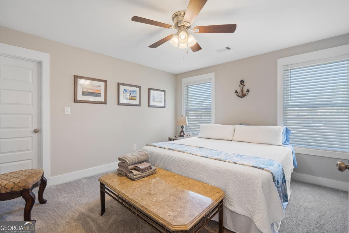 801 Holly Ridge Drive Gray, GA 31032 - Photo 38 of 51 a bedroom that has a bed and a table in it