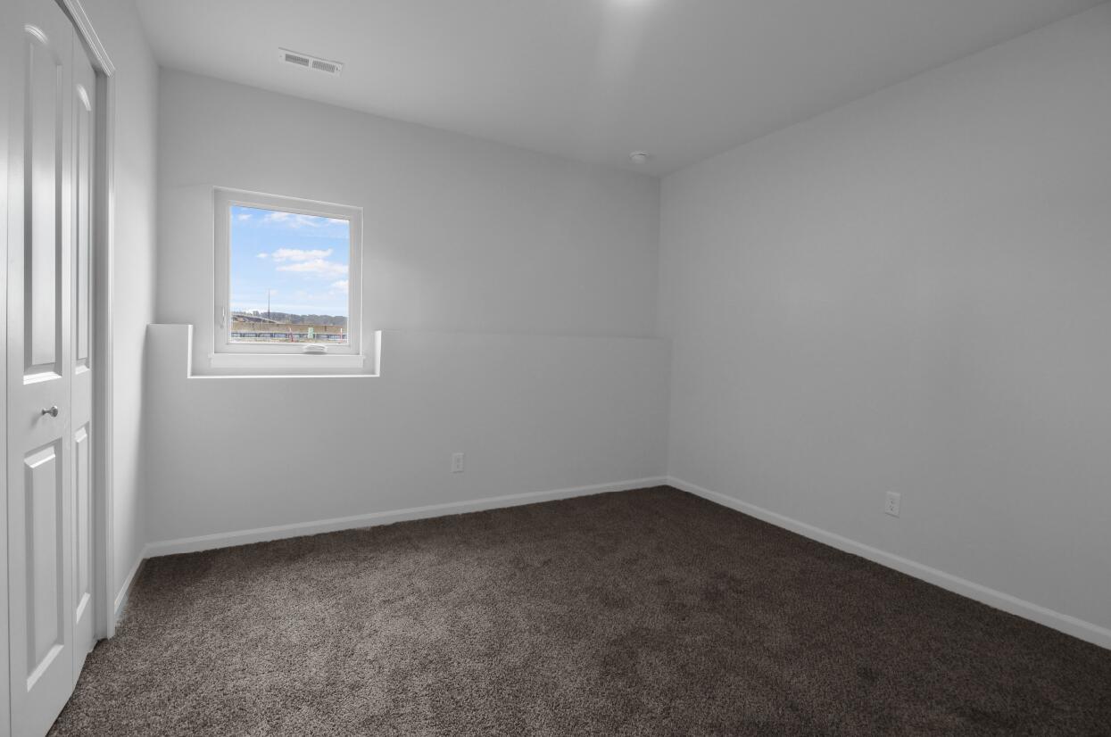 3103 West 82nd Place, Unit 52B Merrillville, IN 46410 - Photo 15 of 18 an empty room with a window