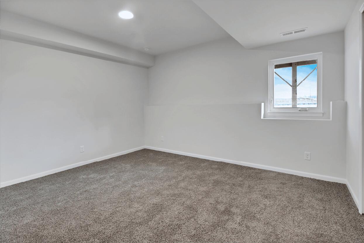 3103 West 82nd Place, Unit 52B Merrillville, IN 46410 - Photo 16 of 18 an empty room with a window