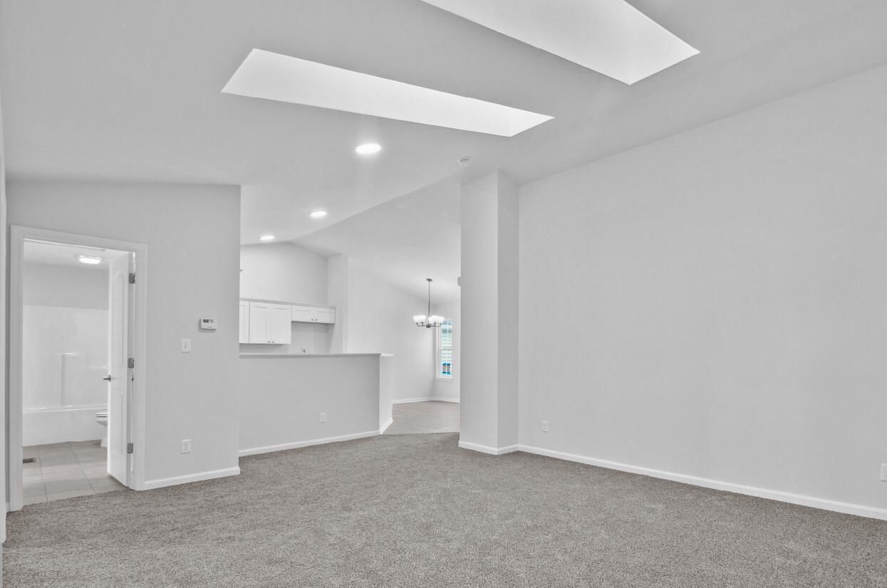 3103 West 82nd Place, Unit 52B Merrillville, IN 46410 - Photo 4 of 18 a view of a kitchen with refrigerator and a sink