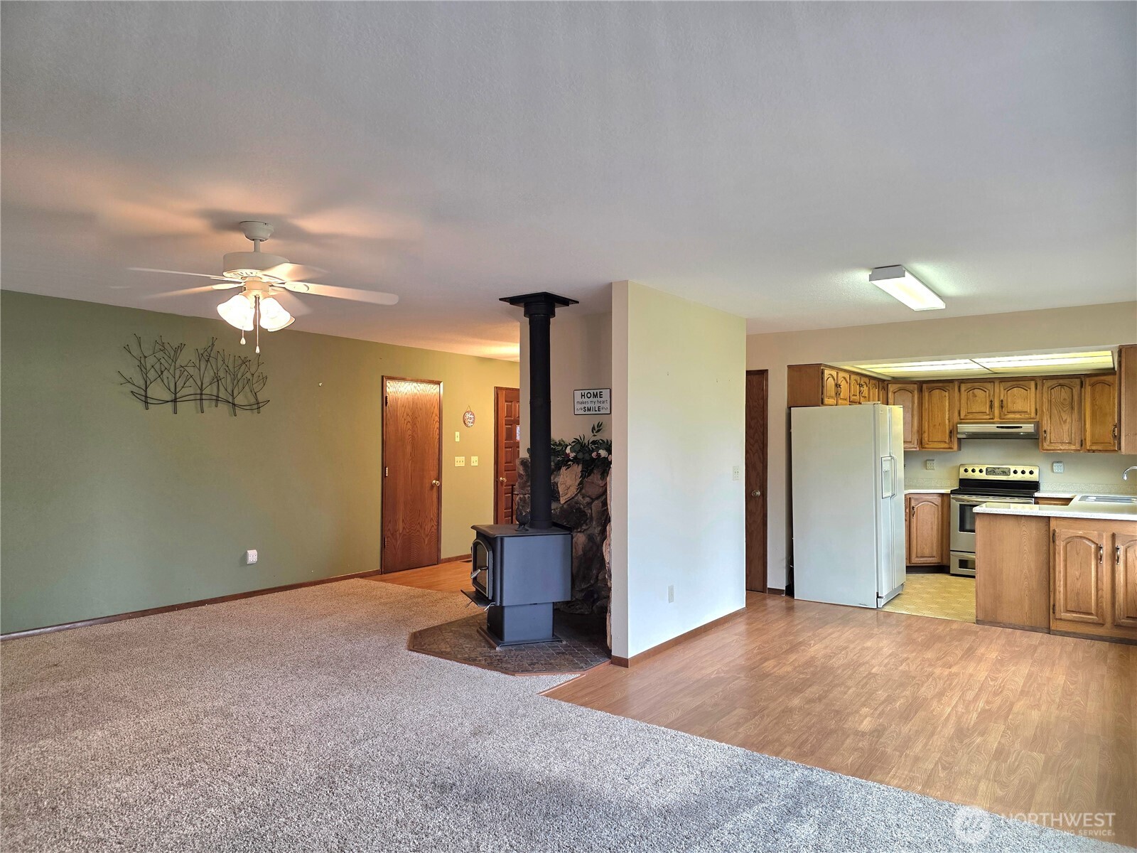 180 Scenic View Drive Longview, WA 98632 - Photo 10 of 33 a view of a kitchen with a sink and a refrigerator