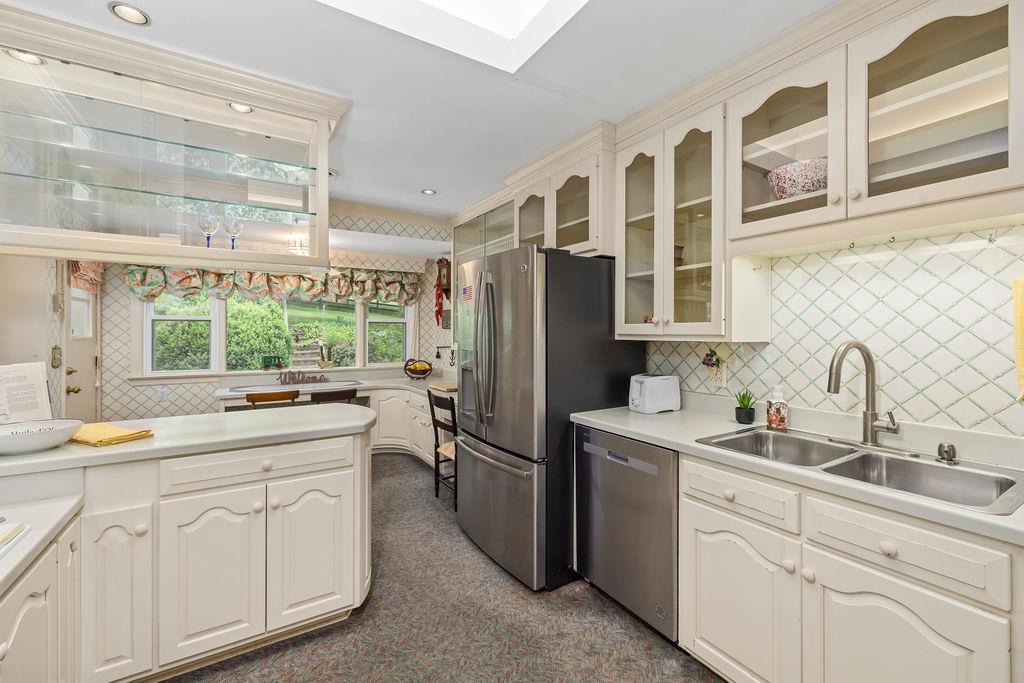 188 Middlebrook Road Staunton, VA 24401 - Photo 27 of 75 a kitchen with white cabinets and white appliances