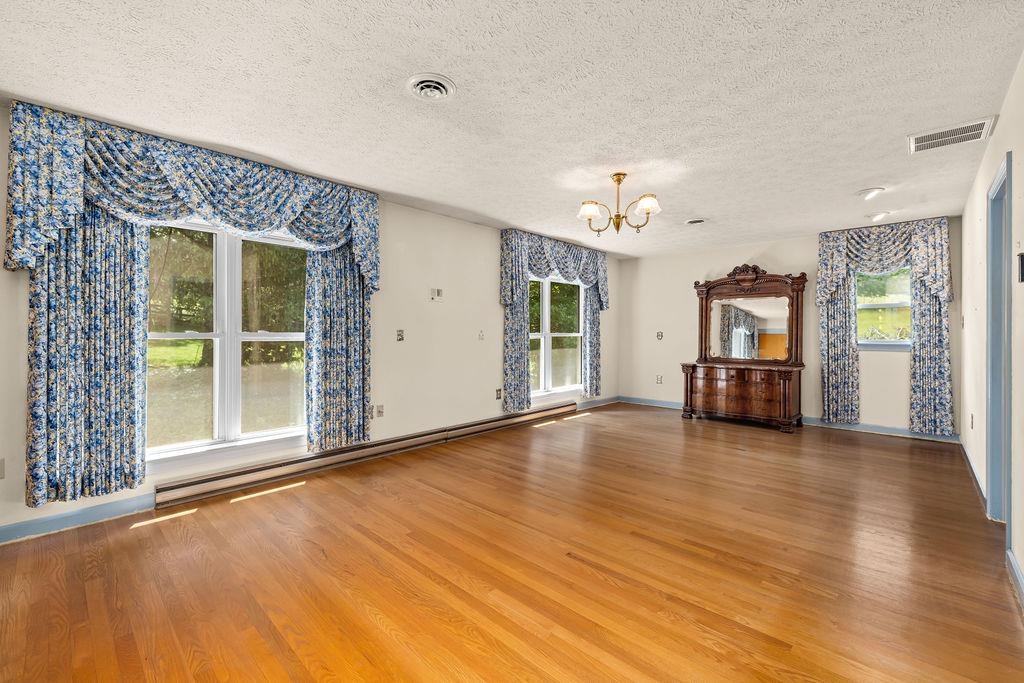 188 Middlebrook Road Staunton, VA 24401 - Photo 44 of 75 a view of a livingroom with wooden floor and a ceiling fan