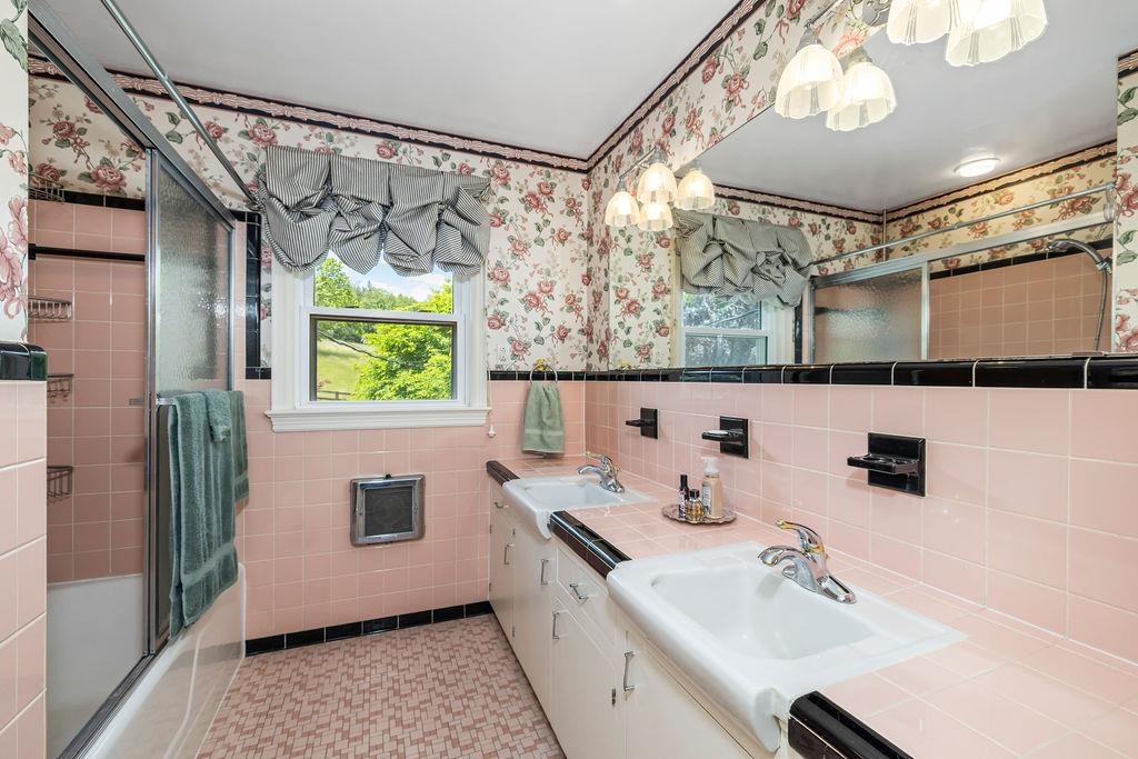 188 Middlebrook Road Staunton, VA 24401 - Photo 52 of 75 a bathroom with a sink mirror and a bathtub
