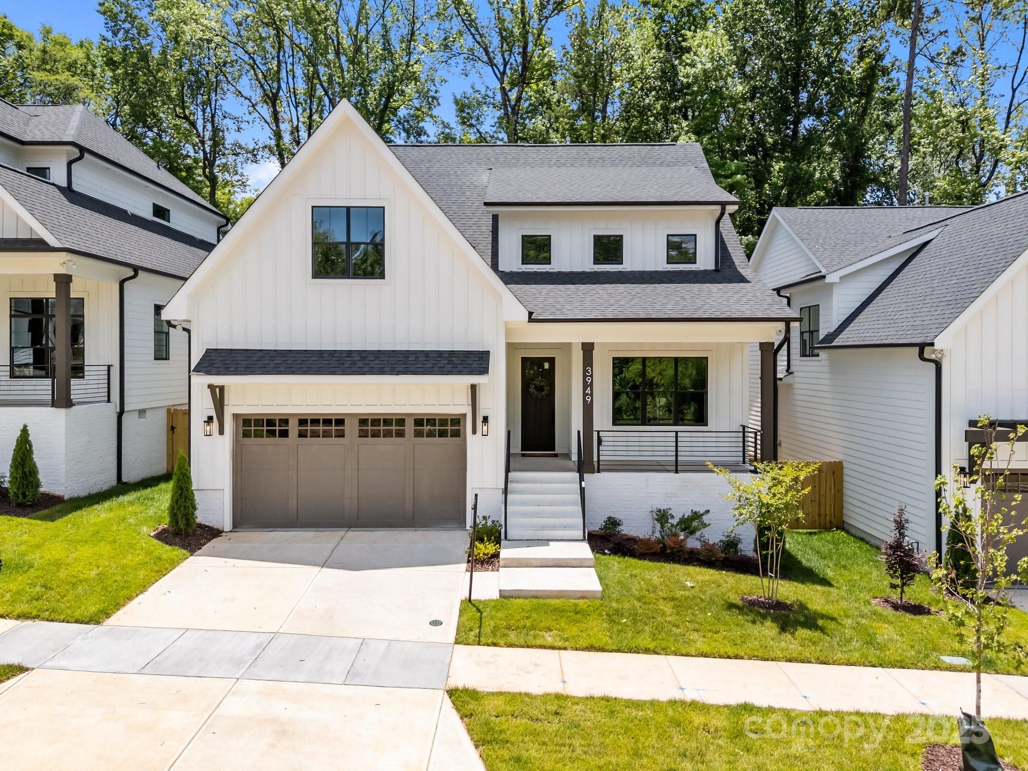 3949 Plainview Road Charlotte, NC 28208 - Photo 1 of 42 a front view of a house with a yard and garage
