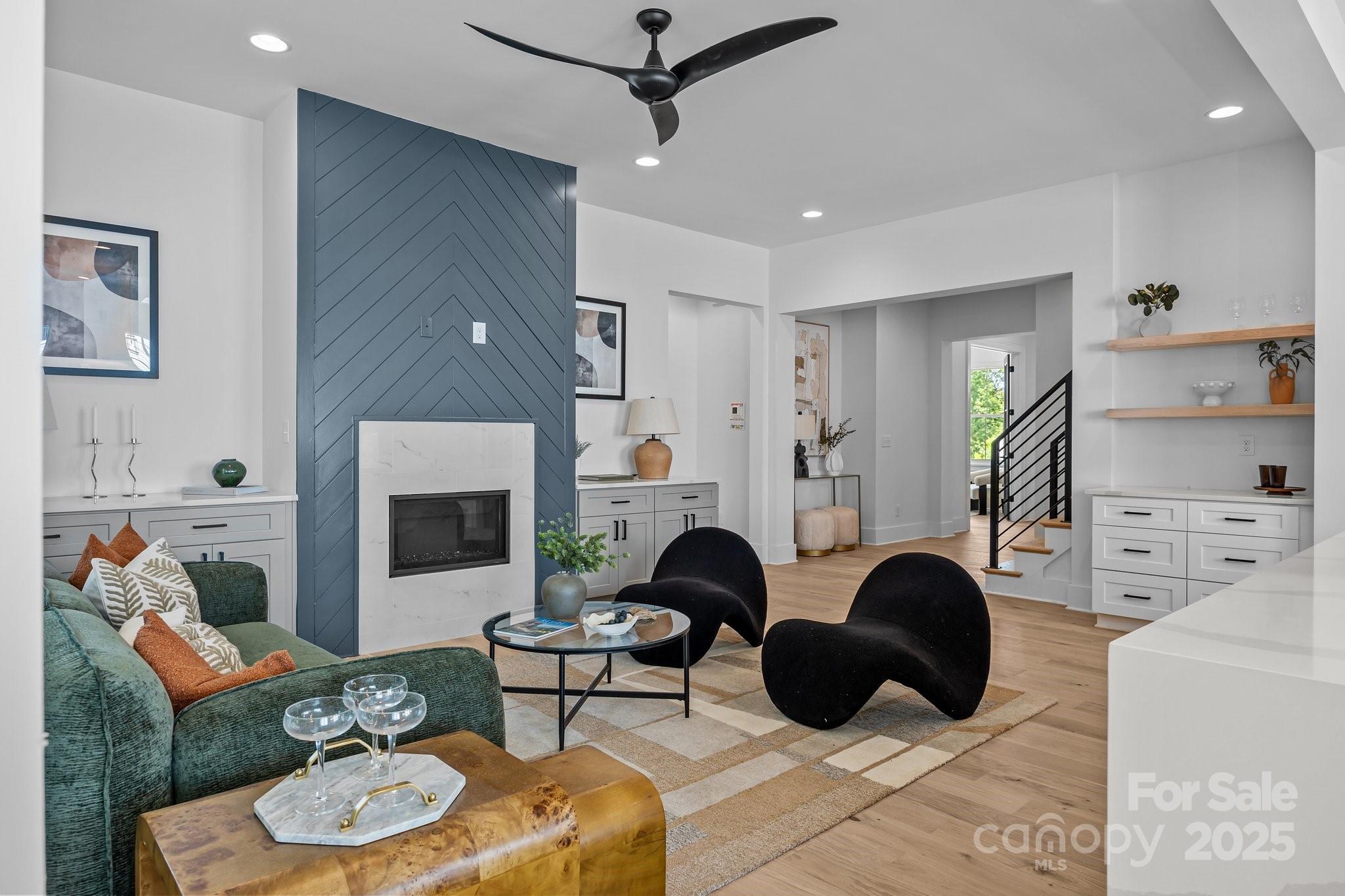 3949 Plainview Road Charlotte, NC 28208 - Photo 19 of 42 a living room with furniture and a fireplace