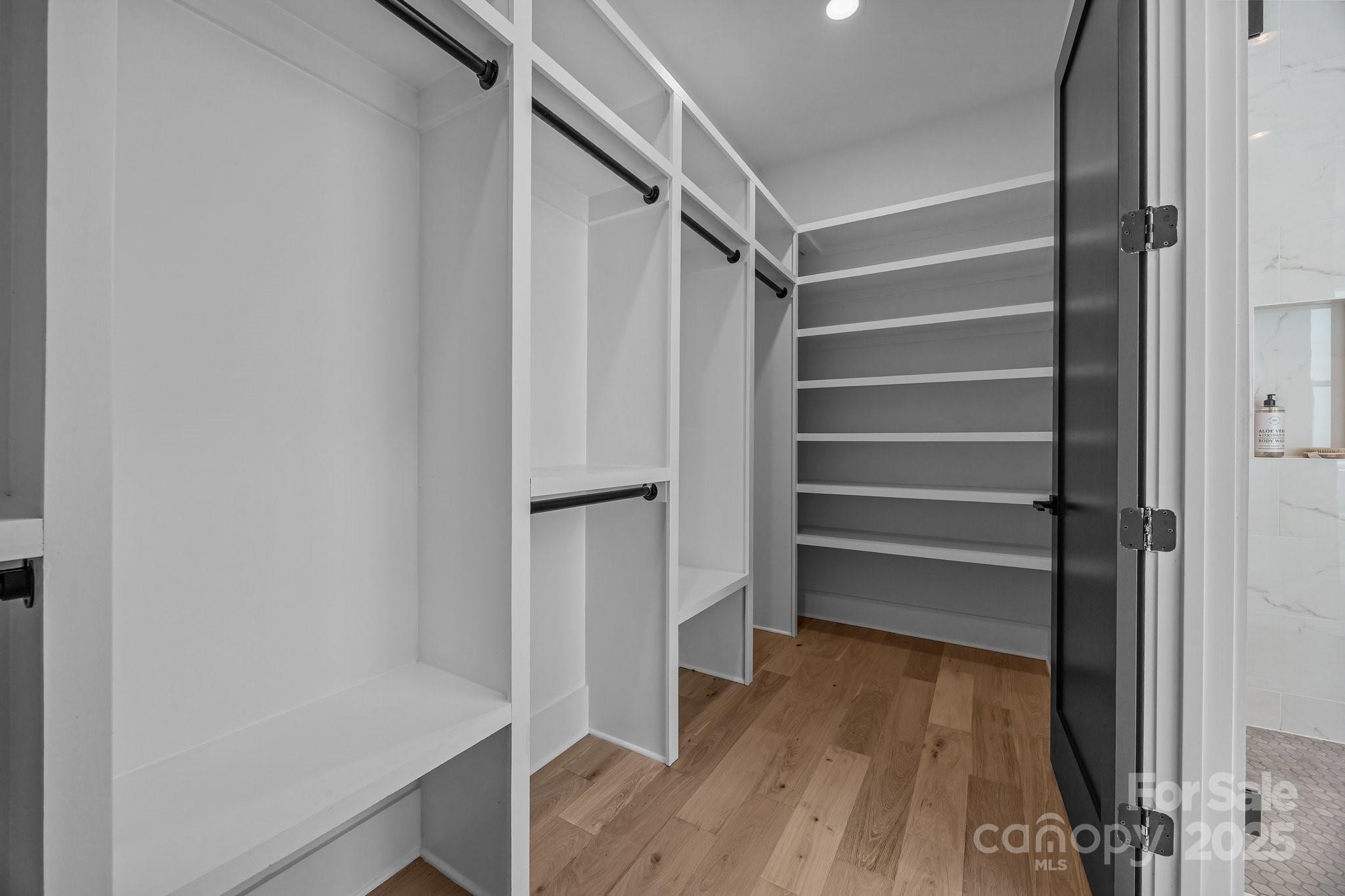 3949 Plainview Road Charlotte, NC 28208 - Photo 23 of 42 a view of walk in closet with empty racks