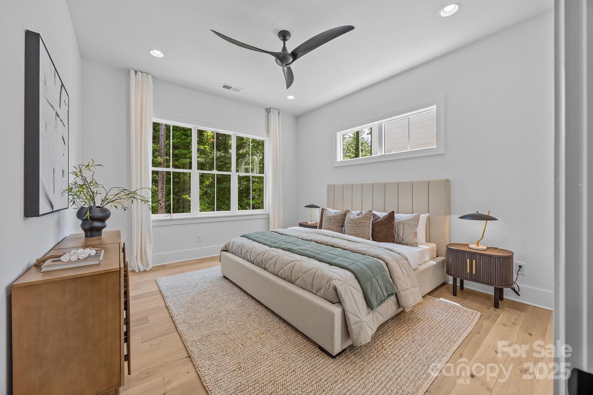 3949 Plainview Road Charlotte, NC 28208 - Photo 28 of 42 a spacious bedroom with a bed and a window