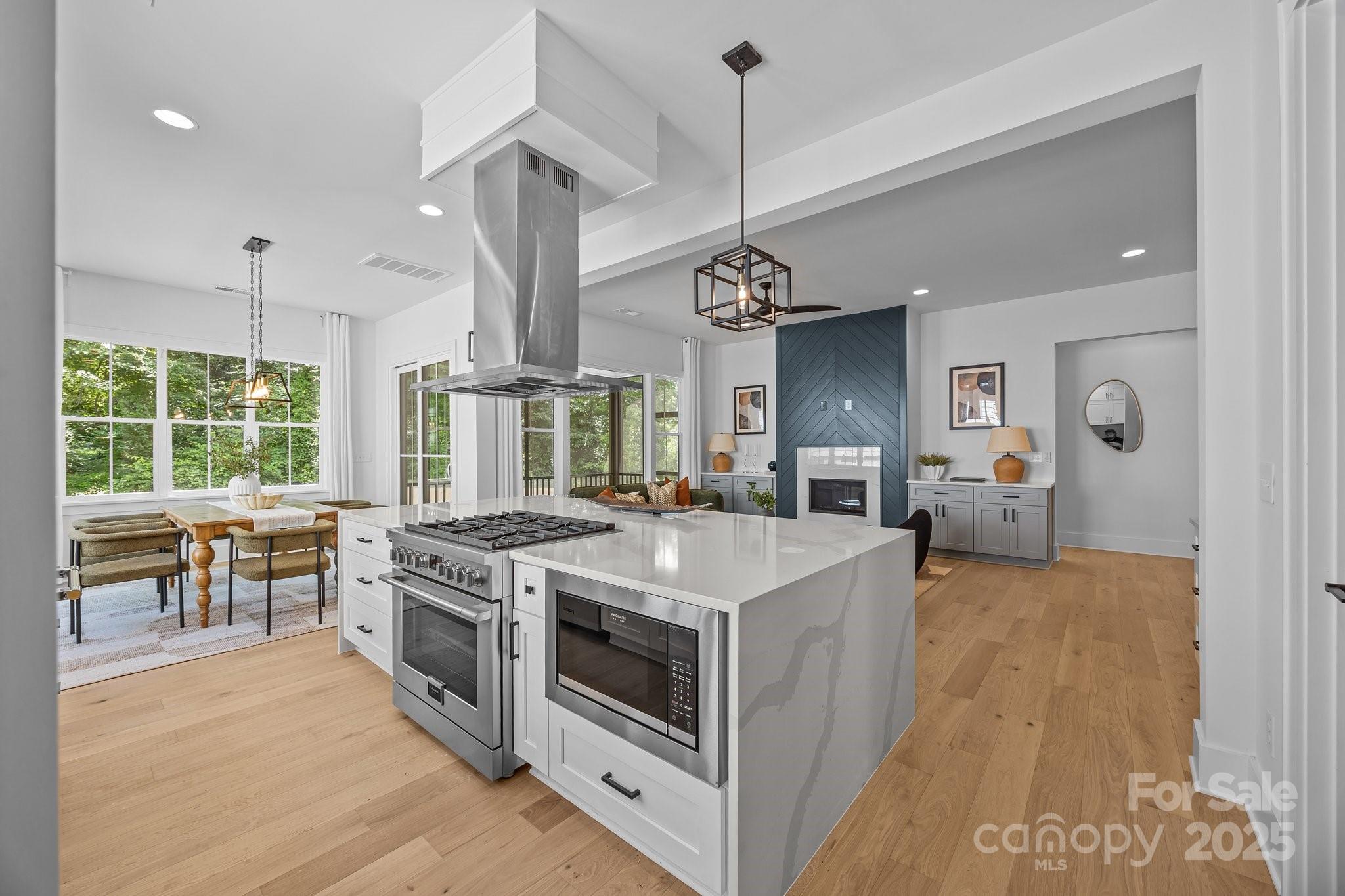 3949 Plainview Road Charlotte, NC 28208 - Photo 34 of 42 a kitchen with a stove and a wooden floor