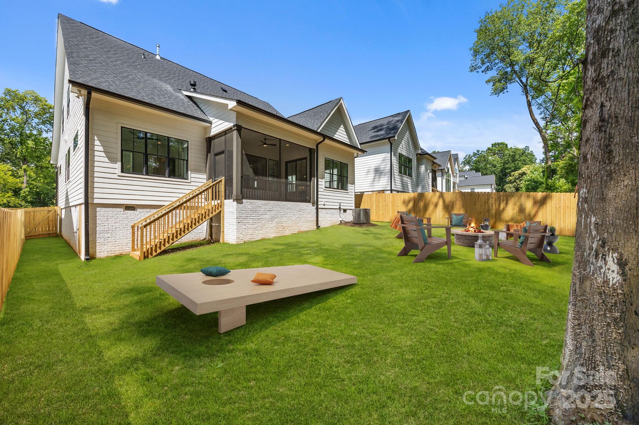 3949 Plainview Road Charlotte, NC 28208 - Photo 5 of 42 a backyard of a house with table and chairs