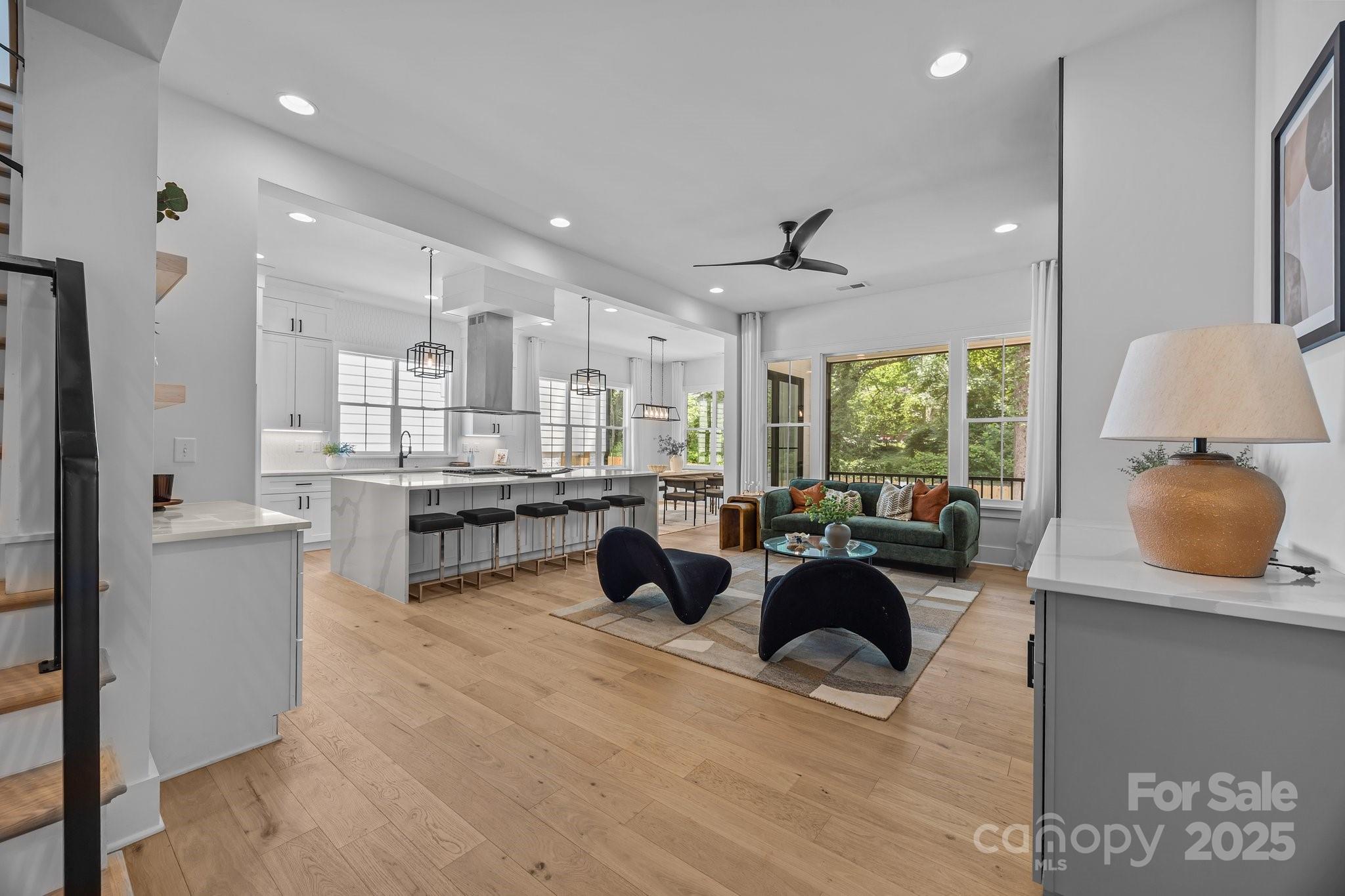 3949 Plainview Road Charlotte, NC 28208 - Photo 8 of 42 a large living room with stainless steel appliances kitchen island granite countertop furniture and a large window