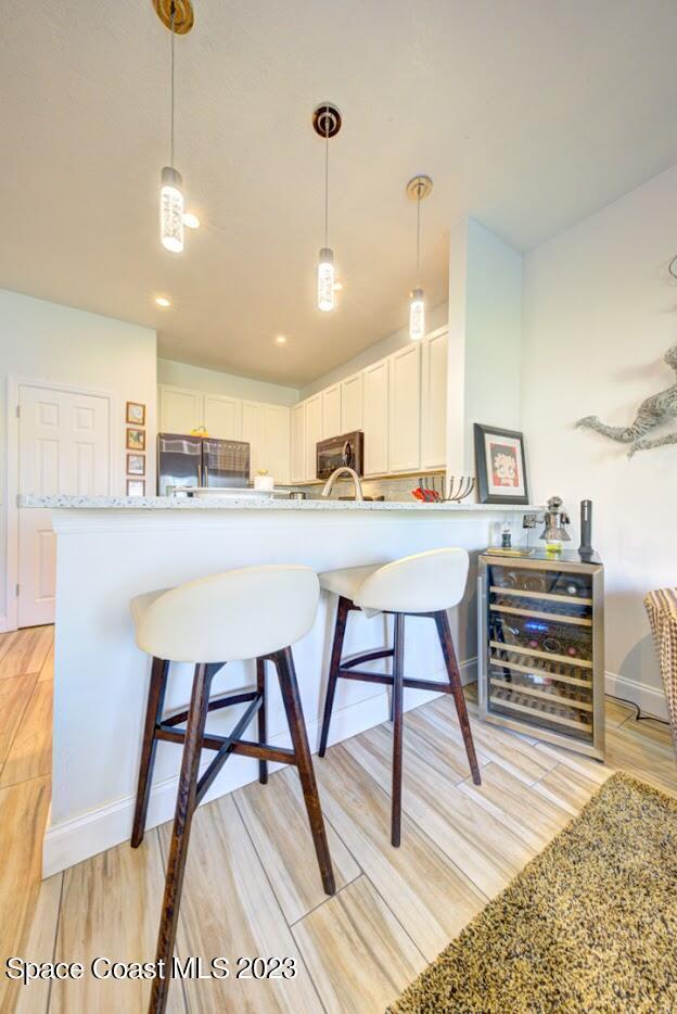 2760 Revolution Street, Unit 103 Melbourne, FL 32935 - Photo 18 of 40 a dining room with a table and chairs