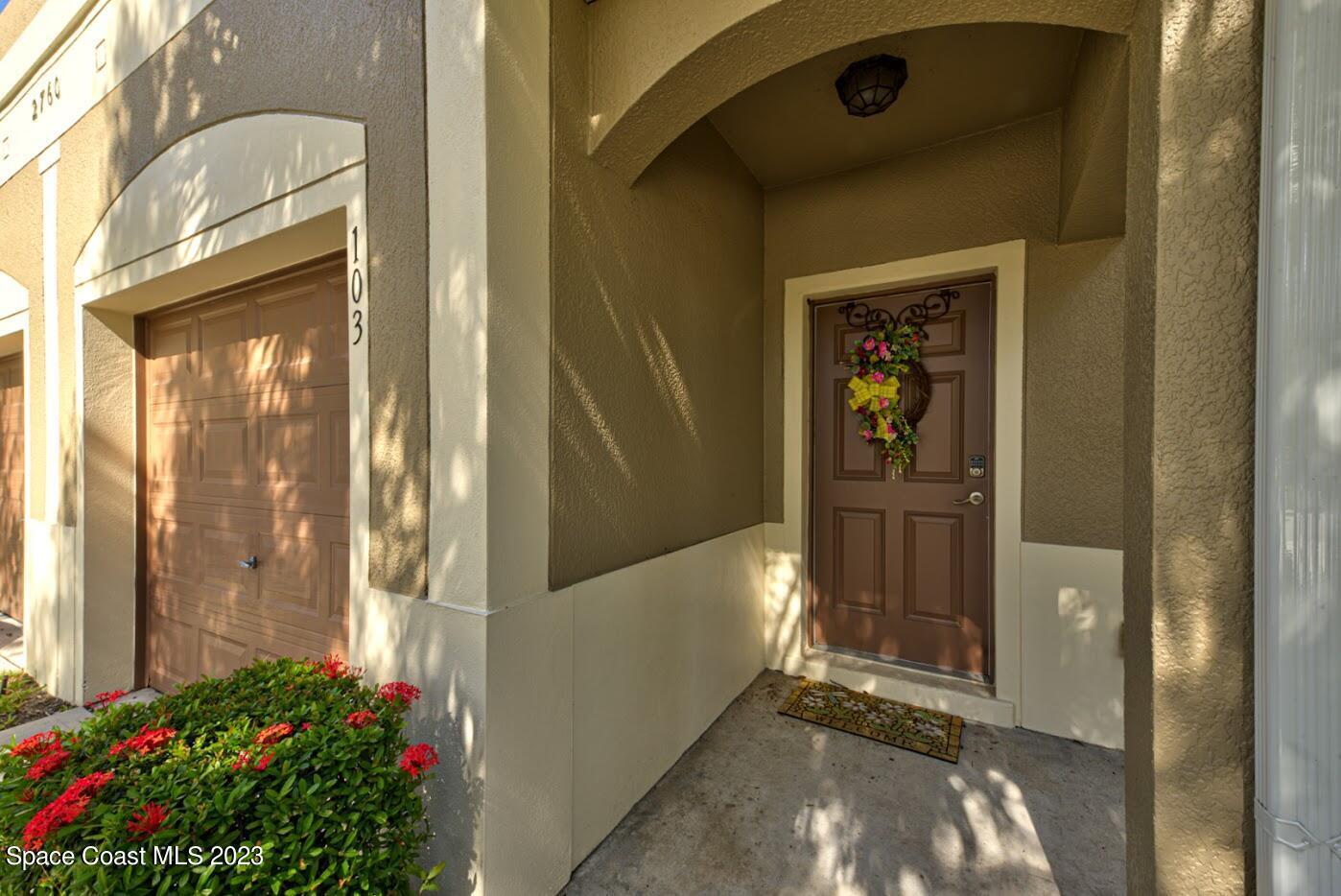 2760 Revolution Street, Unit 103 Melbourne, FL 32935 - Photo 2 of 40 a view of a porch of a house