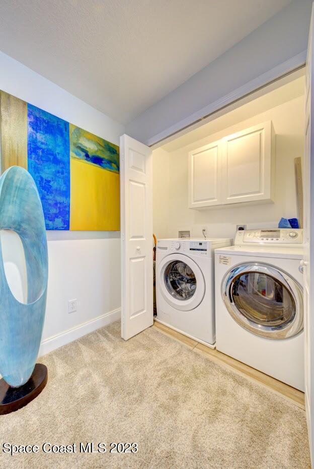 2760 Revolution Street, Unit 103 Melbourne, FL 32935 - Photo 22 of 40 a utility room with dryer and washer