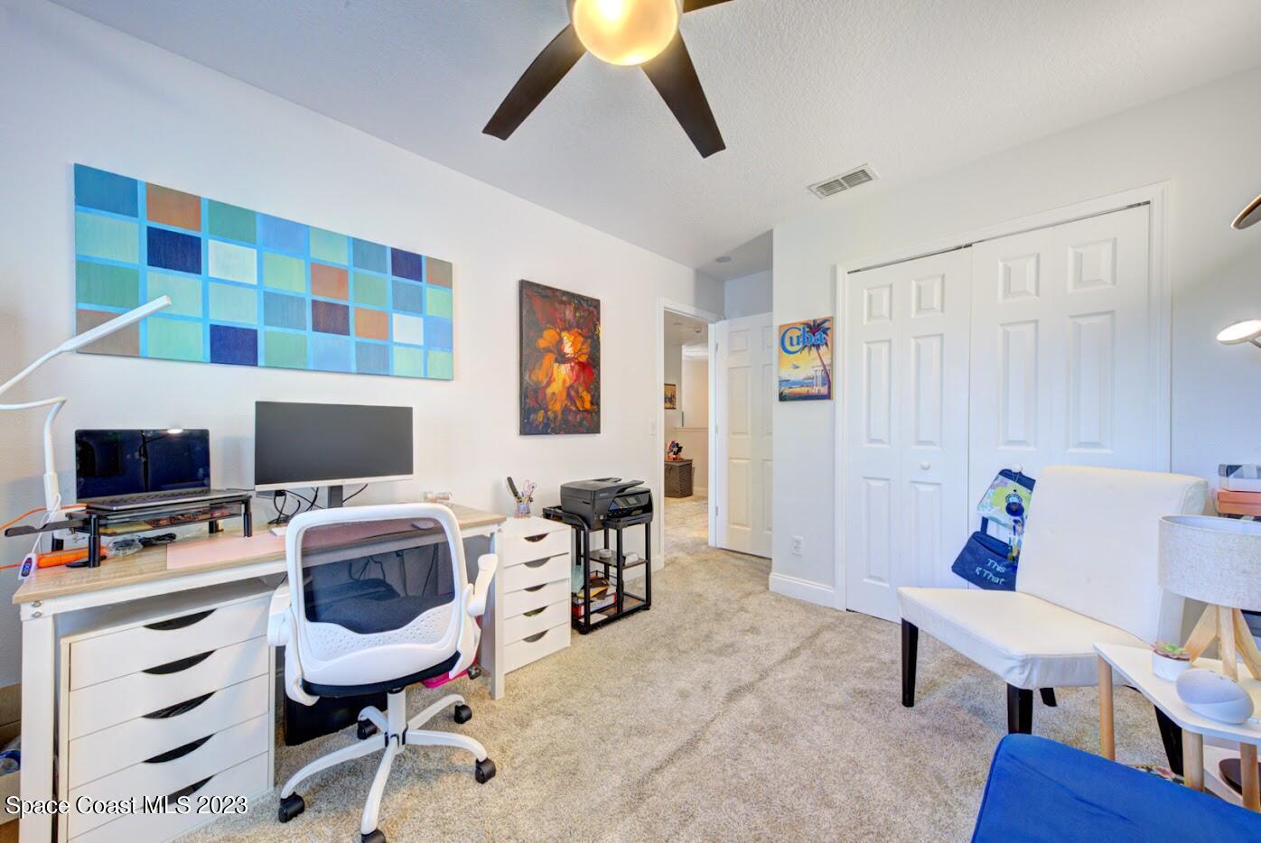 2760 Revolution Street, Unit 103 Melbourne, FL 32935 - Photo 29 of 40 a workspace with furniture and window