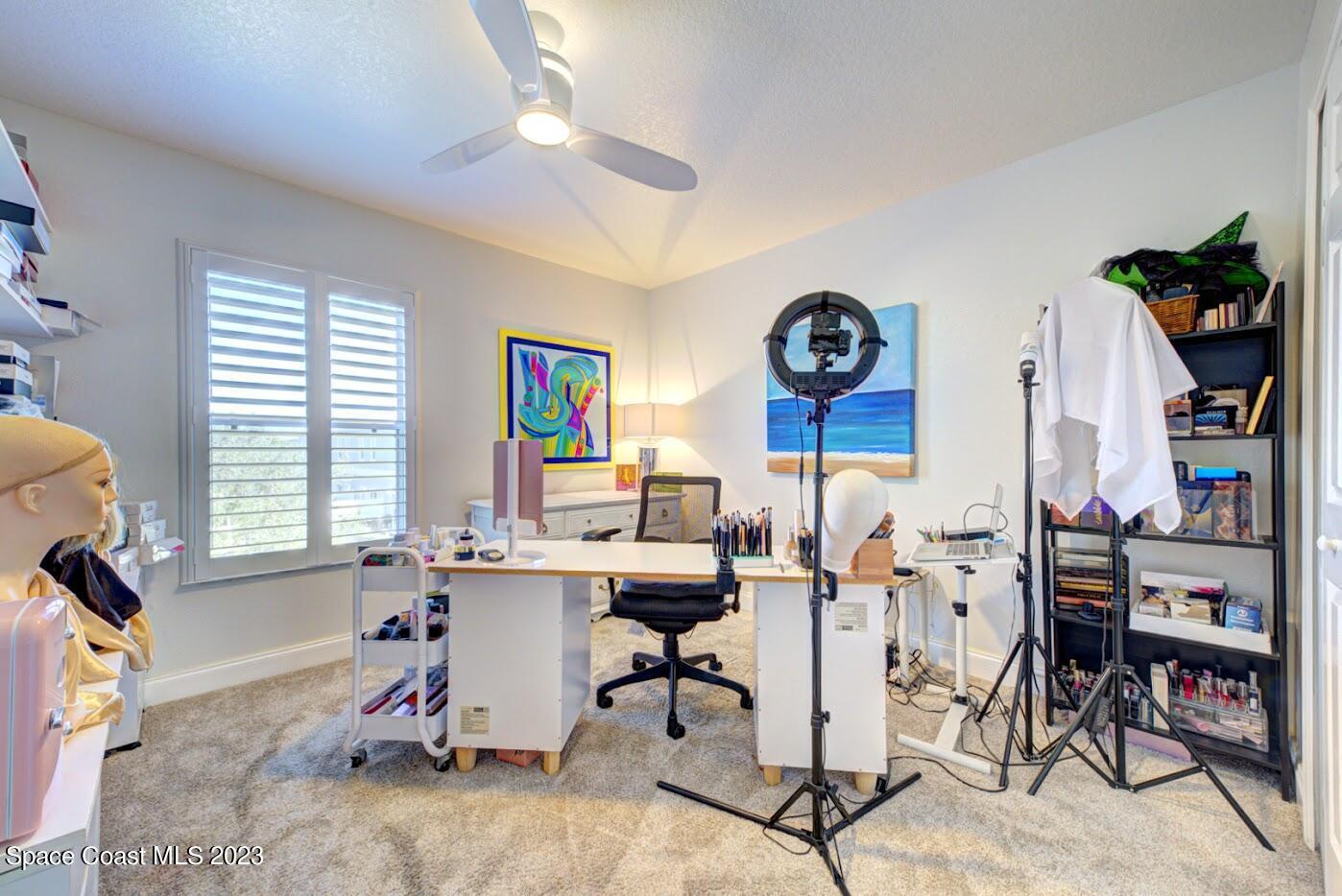 2760 Revolution Street, Unit 103 Melbourne, FL 32935 - Photo 30 of 40 a view of a workspace with furniture and a window