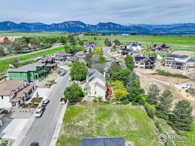 a view of a city with mountains in the background