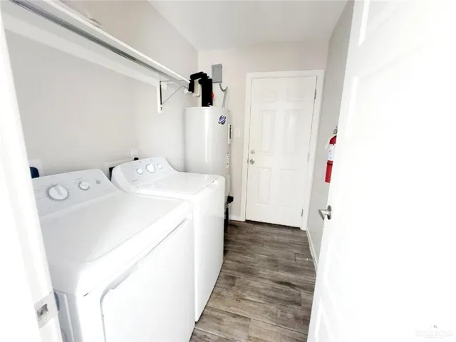 a white toilet sitting next to a bathroom sink and a bathtub