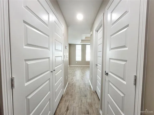 a kitchen with stainless steel appliances a refrigerator sink and microwave